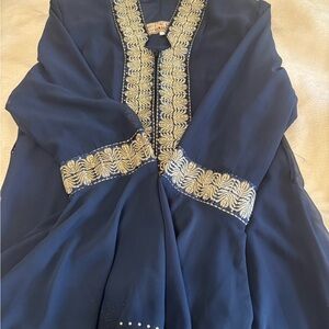 Elegant Blue Kaftan with Gold Embroidery
Hijabs were